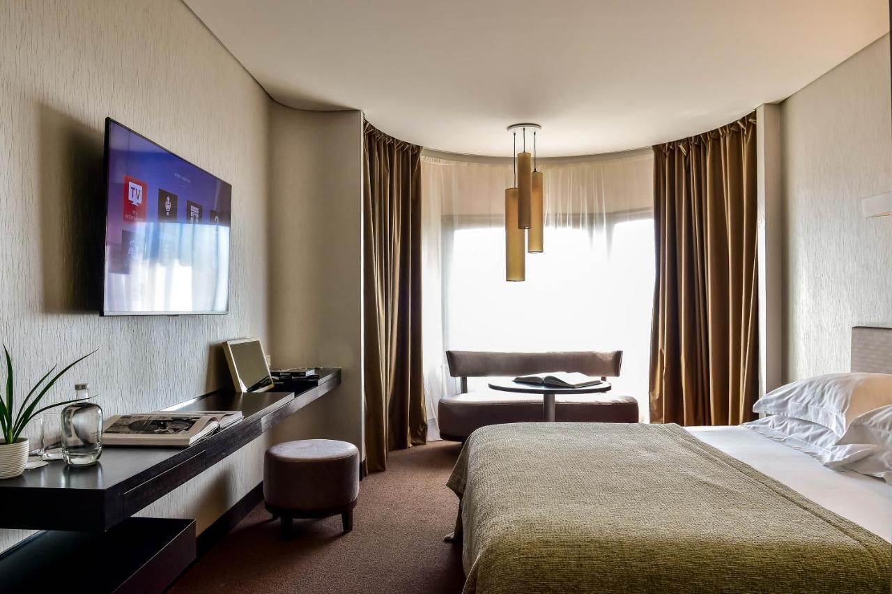 Porto Palacio Hotel By The Editory Bagian luar foto A room at the hotel